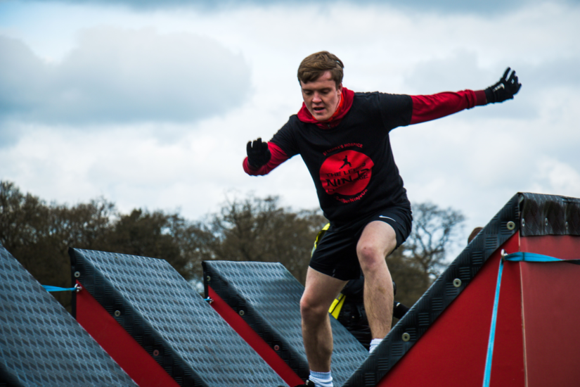 Man tackling obstacle course
